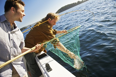 Two Men Fishing in Motorboat