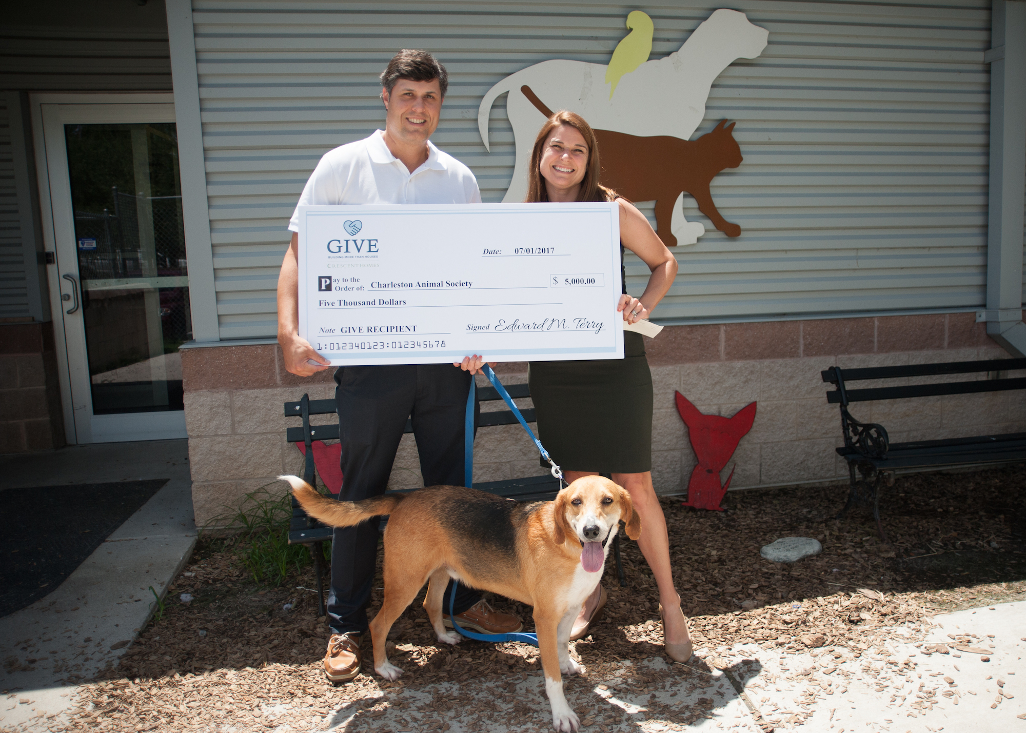 Ted Terry presents a check to Habitat for Humanity Charleston