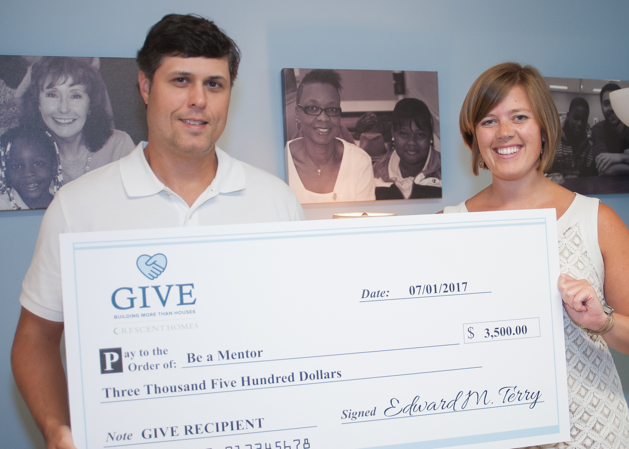 Ted Terry presents a check to Be A Mentor