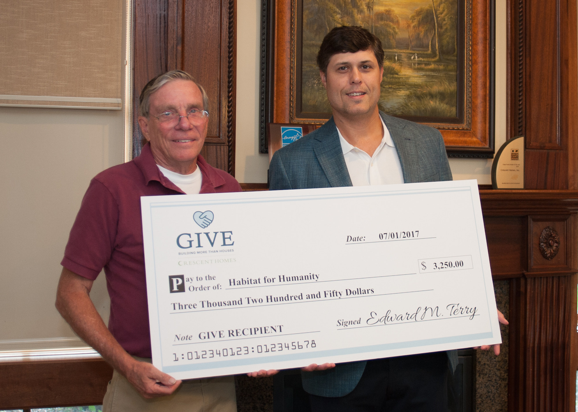 Ted Terry presents a check to Habitat for Humanity Charleston